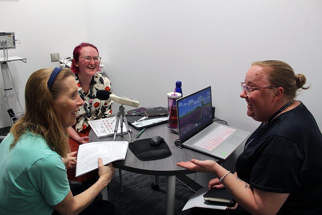 Clinical educator (left), graduate clinician (middle) and client (right) working on Parkinson Voice Therapy